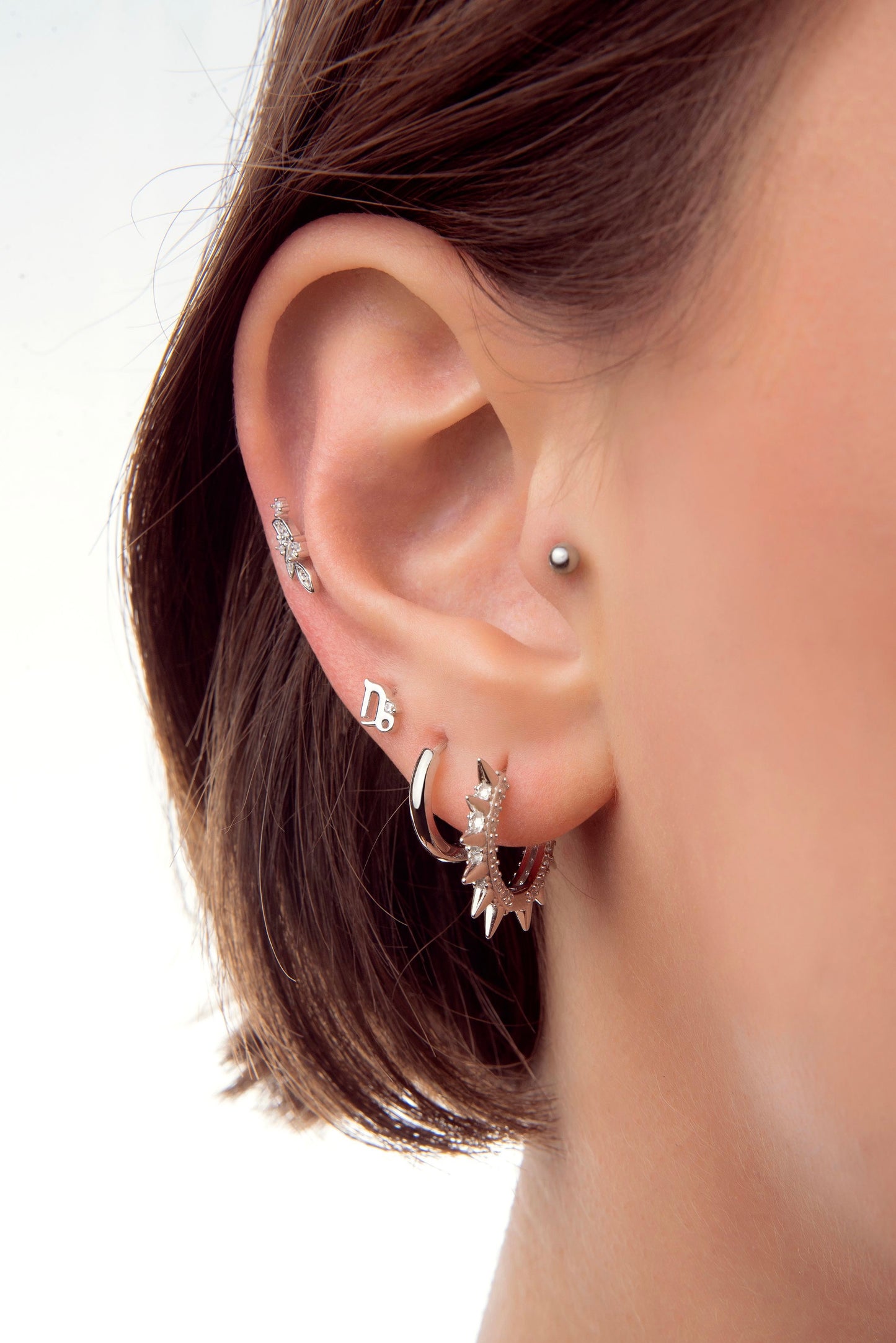 Silver earring piercing