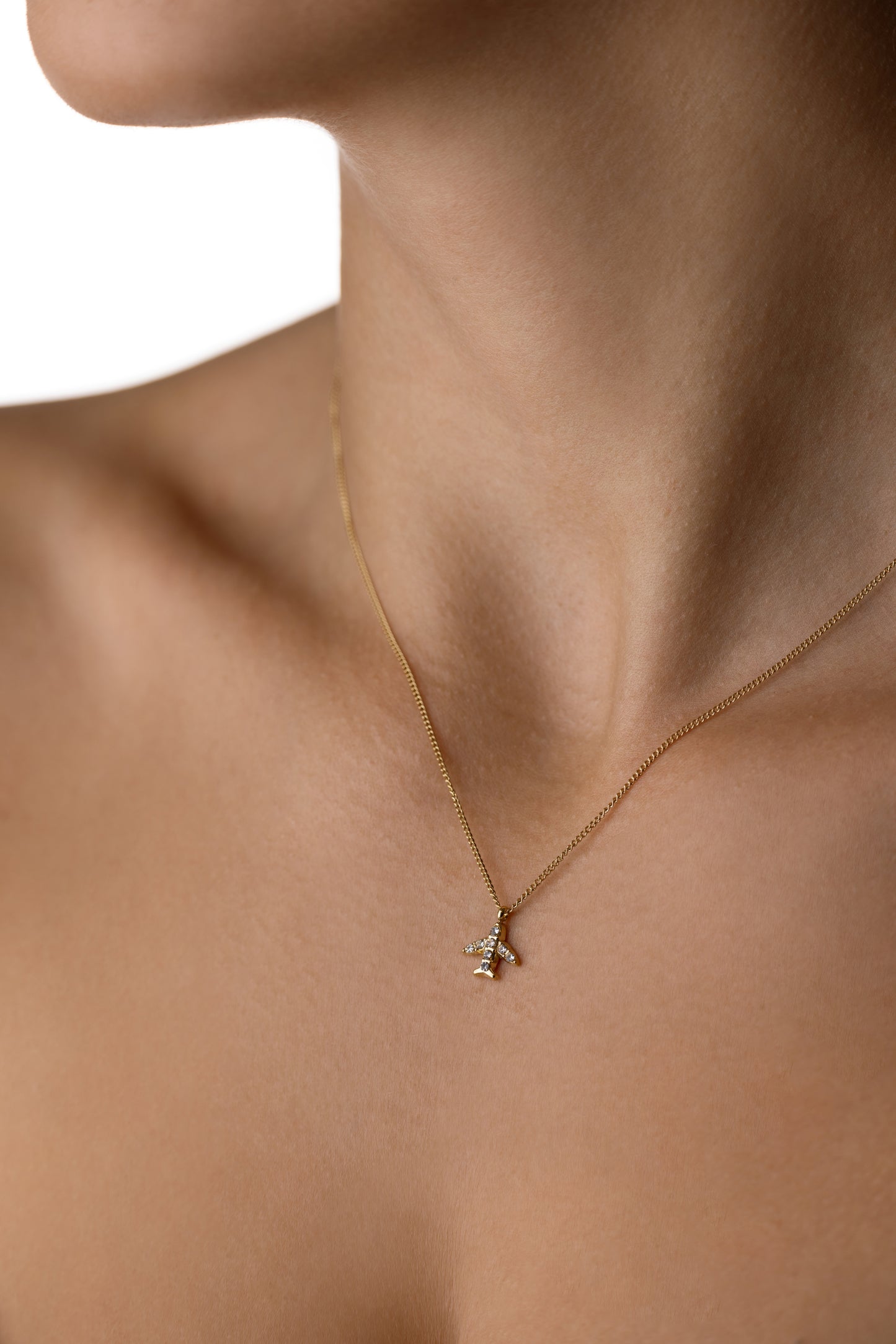 Plane necklace with white zircons