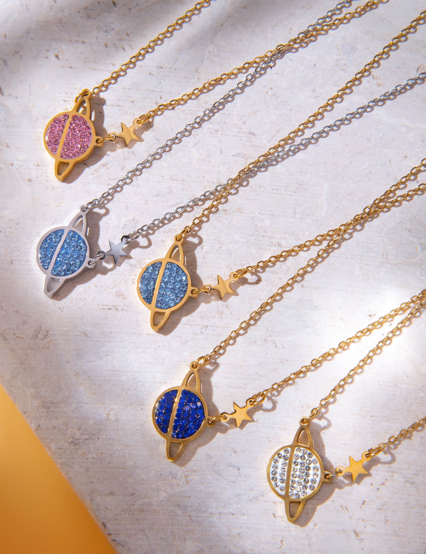 Planet necklace with pink crystals