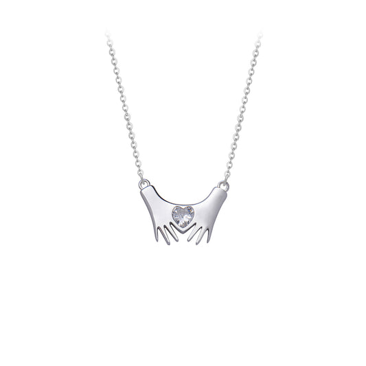 Silver necklace hands with heart